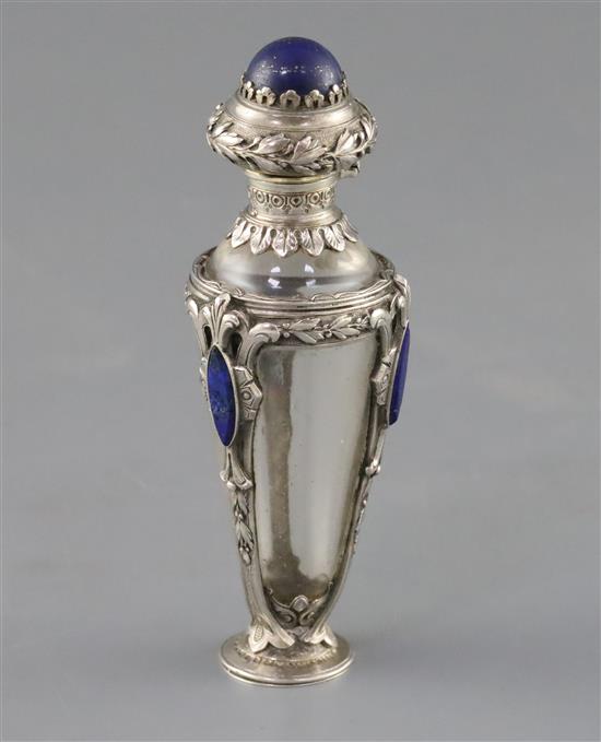 A 19th century French? white metal and lapis lazuli mounted rock crystal? scent bottle and glass stopper, gross weight 58.8 grams.